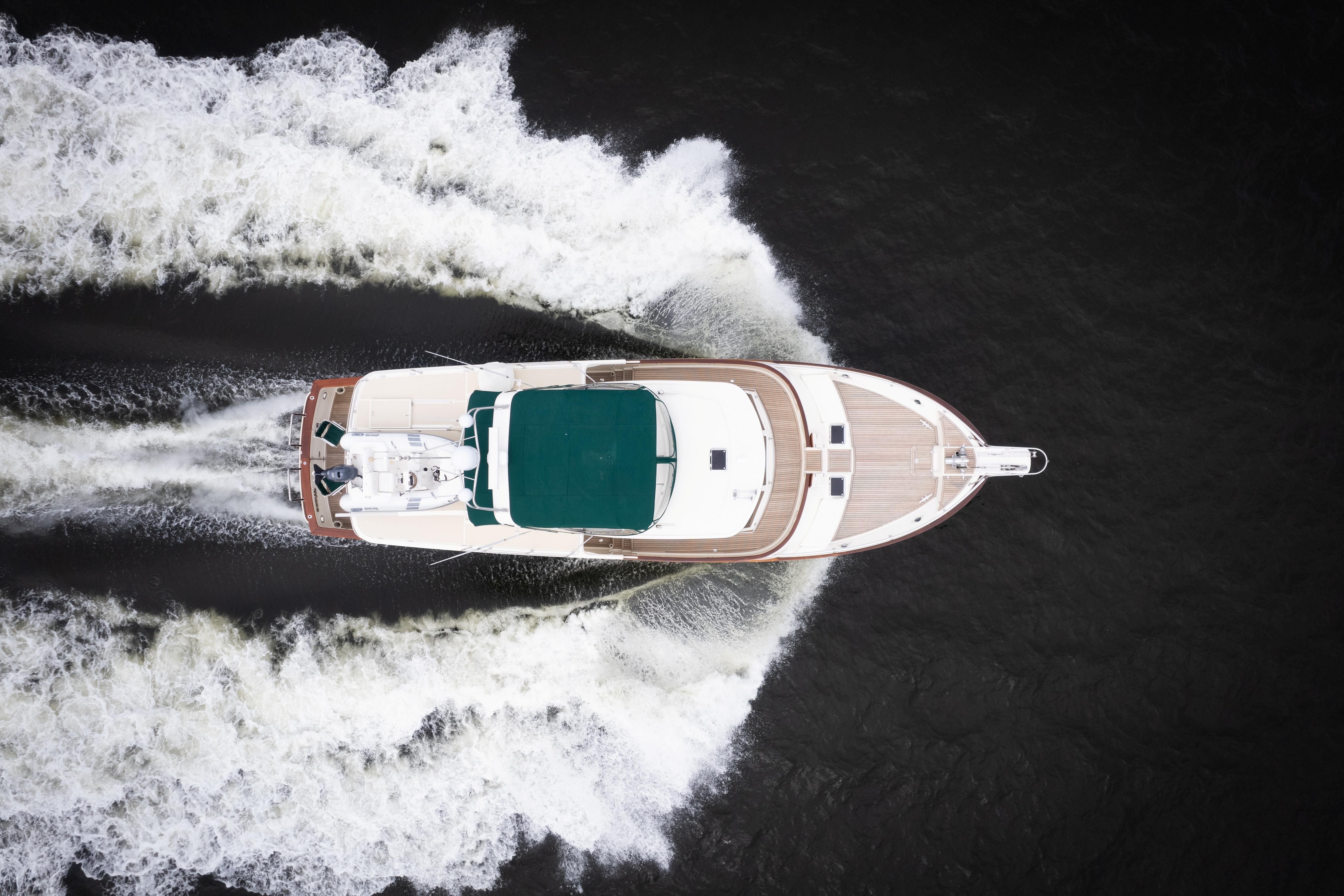 Aerial view of 2007 Fleming 55 yacht cruising through water, leaving a wake.
