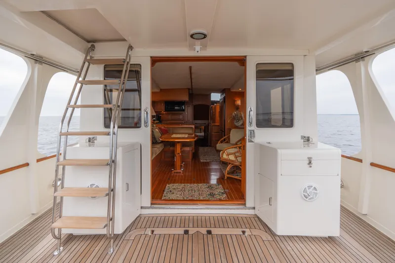 Fiddlesticks Yacht Photos Pics Luxurious 2007 Fleming 55 yacht interior with elegant wood finishes and ocean view.