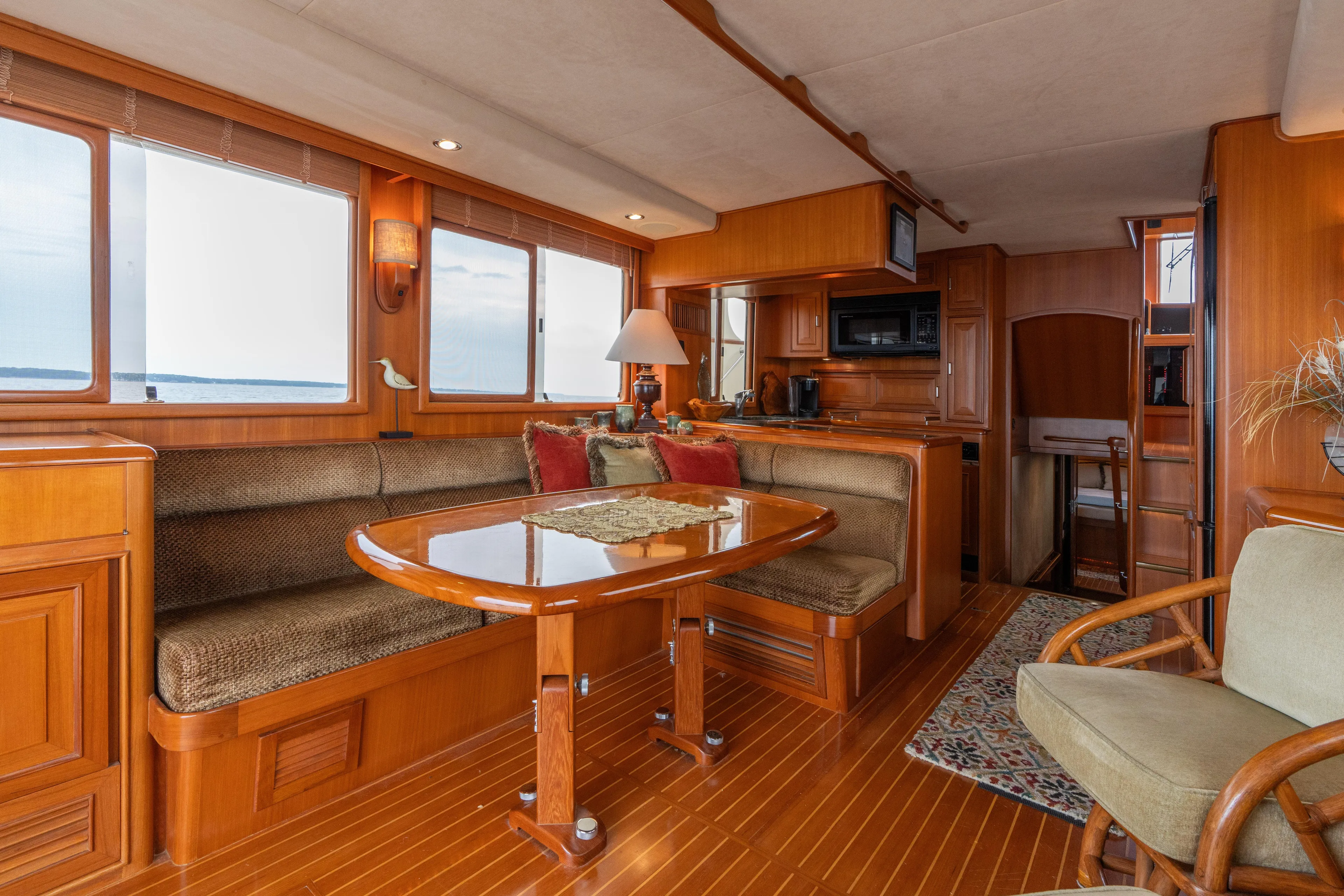 Fiddlesticks Yacht Photos Pics Luxurious 2007 Fleming 55 yacht interior with elegant wood finish and cozy seating area.