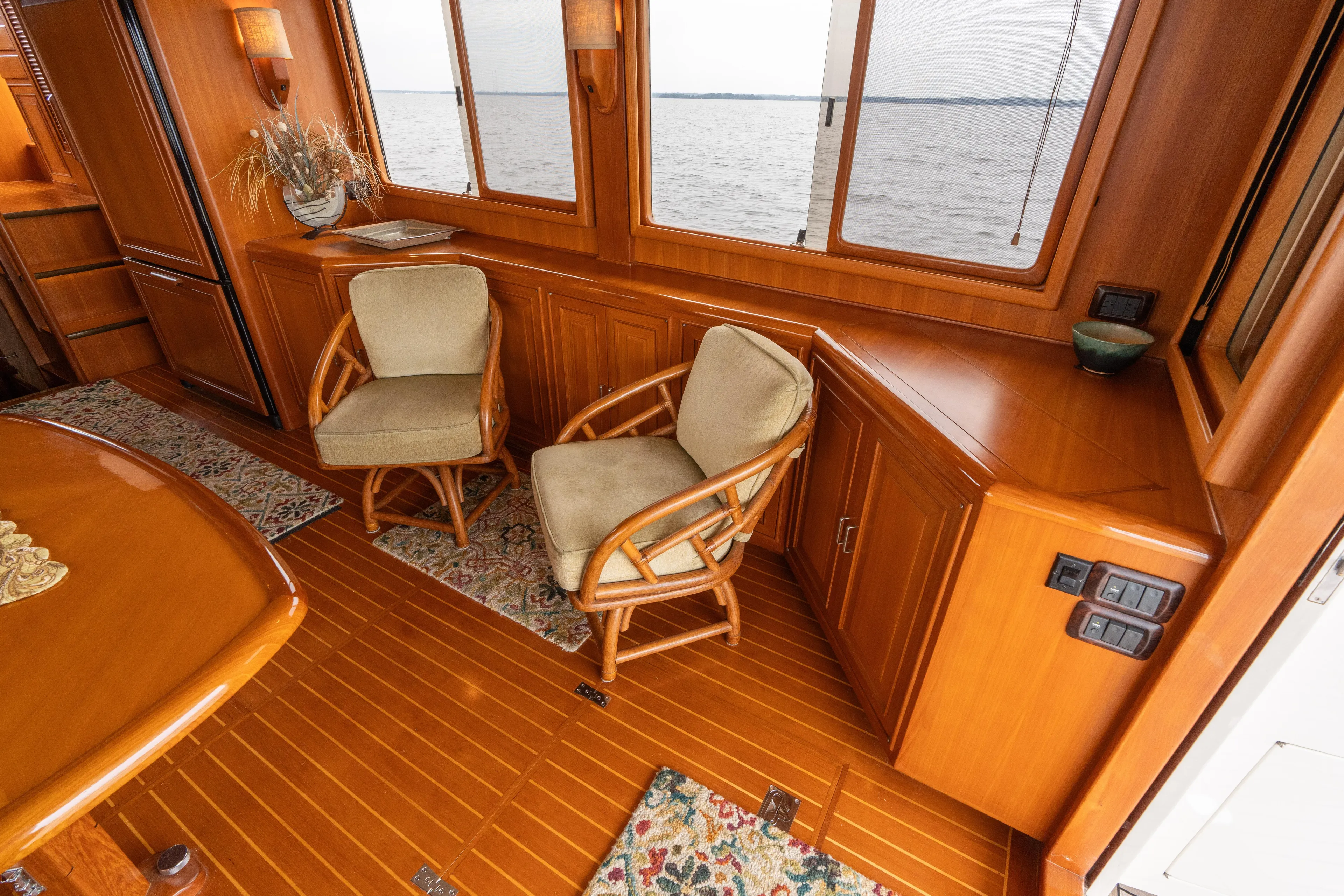 Fiddlesticks Yacht Photos Pics Luxurious 2007 Fleming 55 yacht interior with wooden furnishings and ocean view.