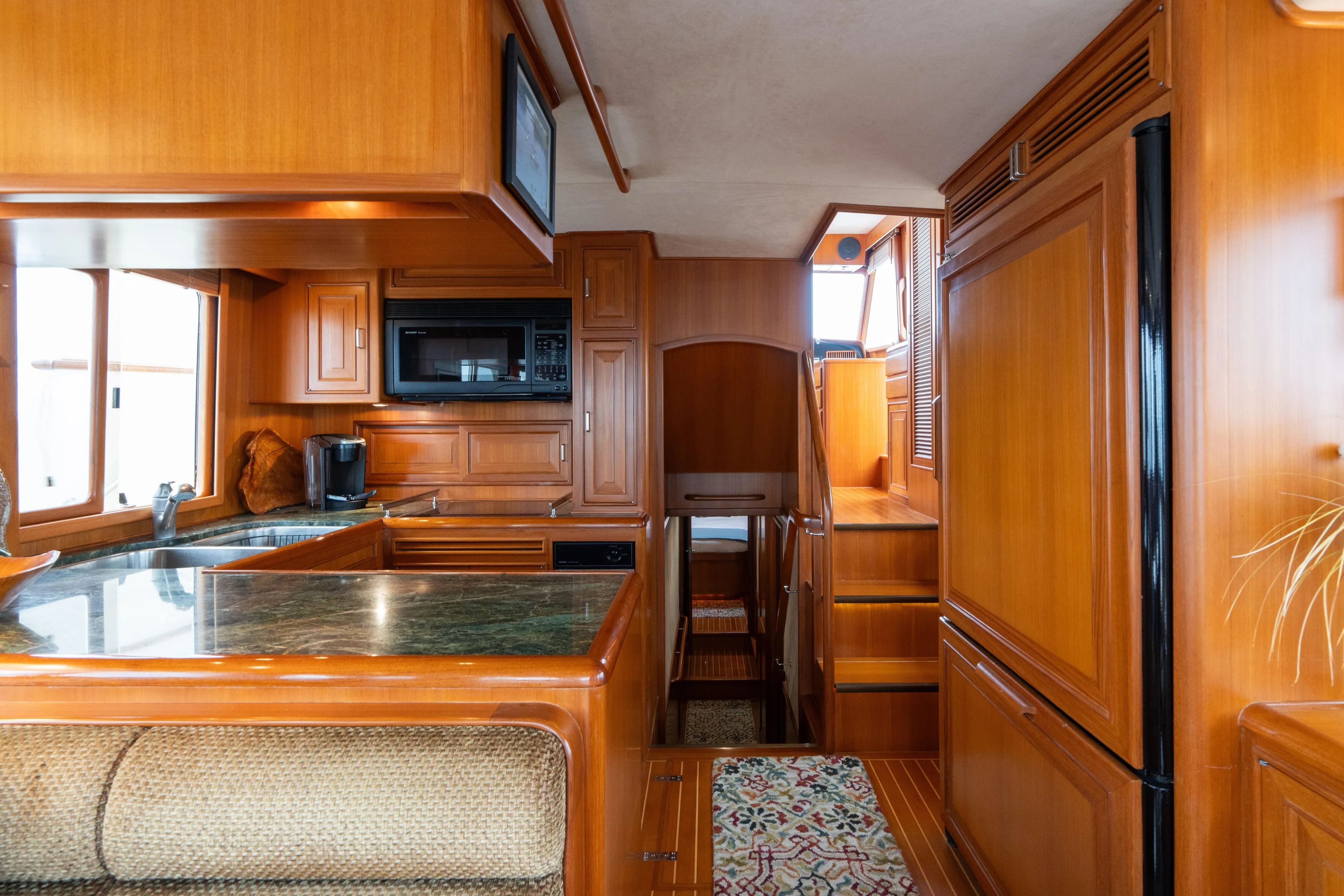 Fiddlesticks Yacht Photos Pics Luxurious 2007 Fleming 55 yacht interior with wood cabinetry and modern kitchen amenities.