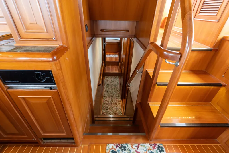 Fiddlesticks Yacht Photos Pics Interior of 2007 Fleming 55 yacht with wooden stairs and cabinetry.