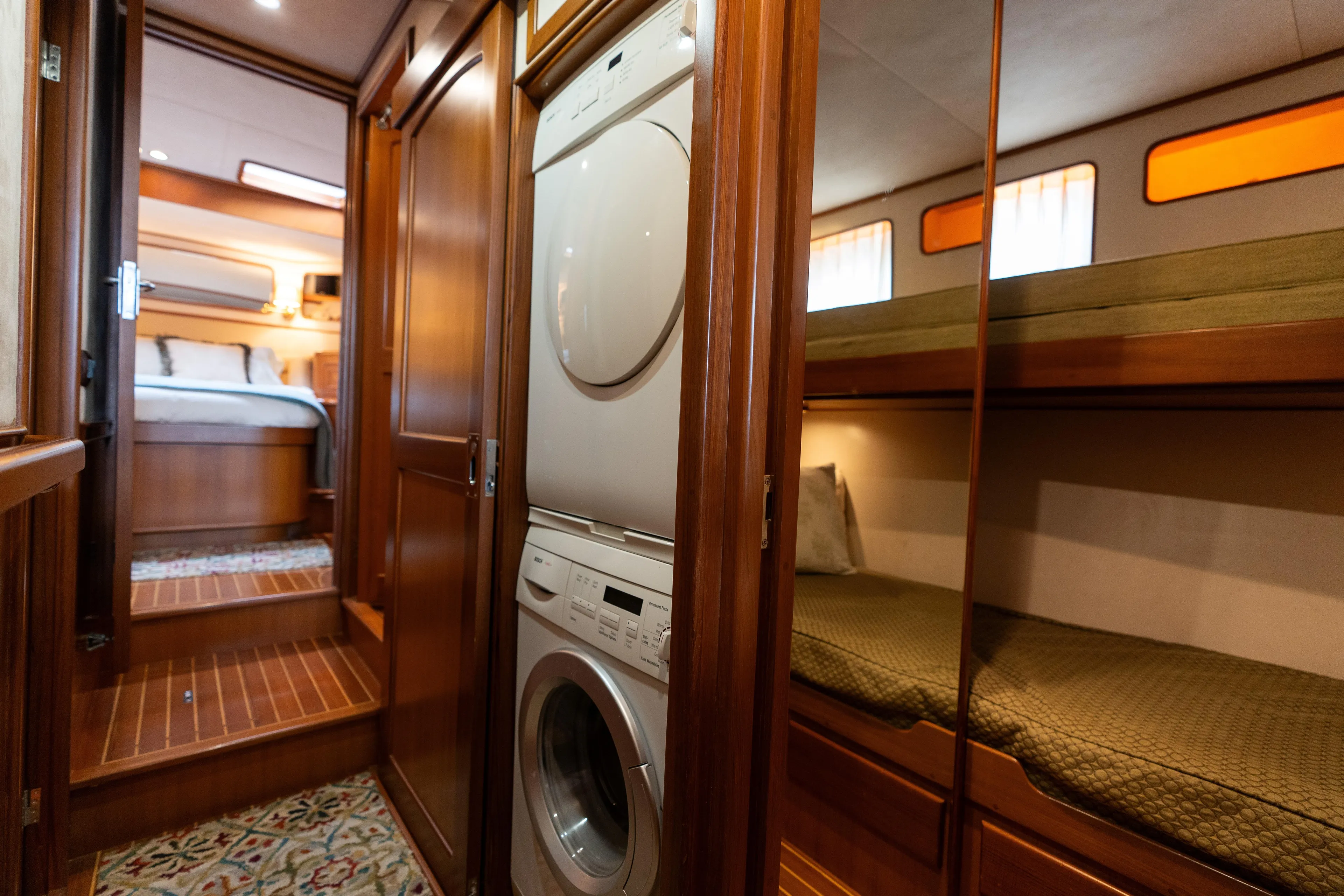 Fiddlesticks Yacht Photos Pics Laundry area and bunk beds inside a 2007 Fleming 55 yacht interior.