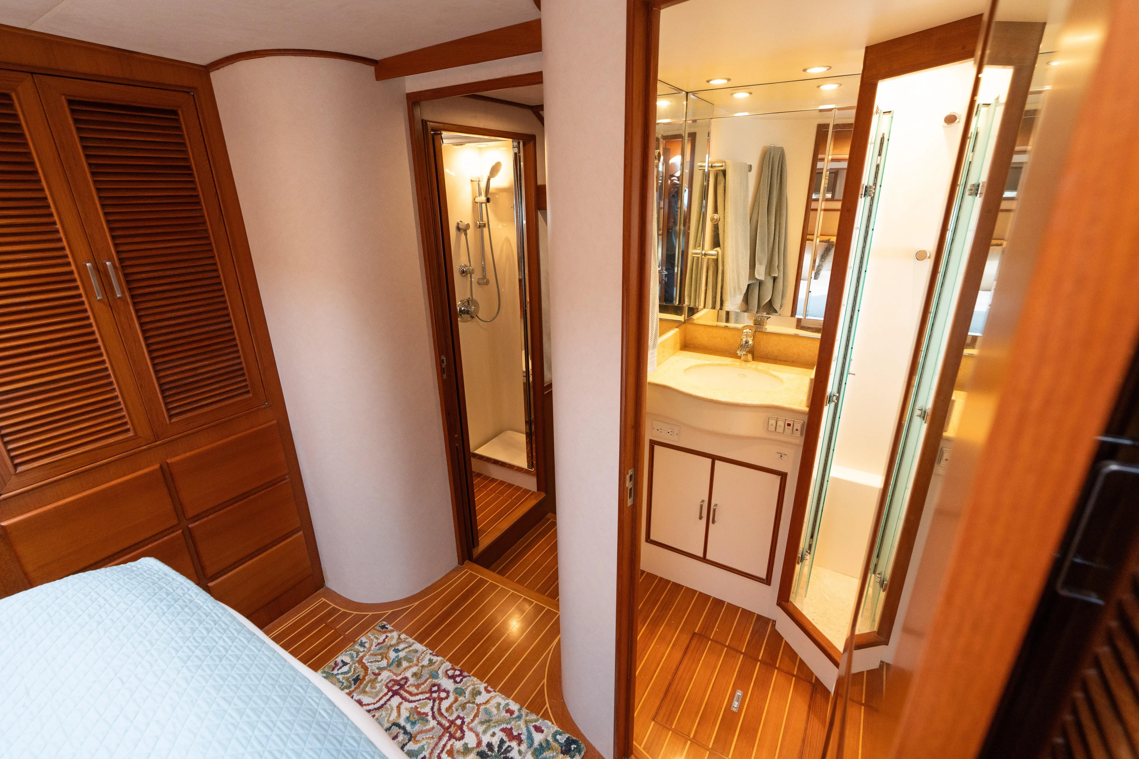 Fiddlesticks Yacht Photos Pics Luxurious 2007 Fleming 55 yacht interior with wood finishes, bathroom, and shower.