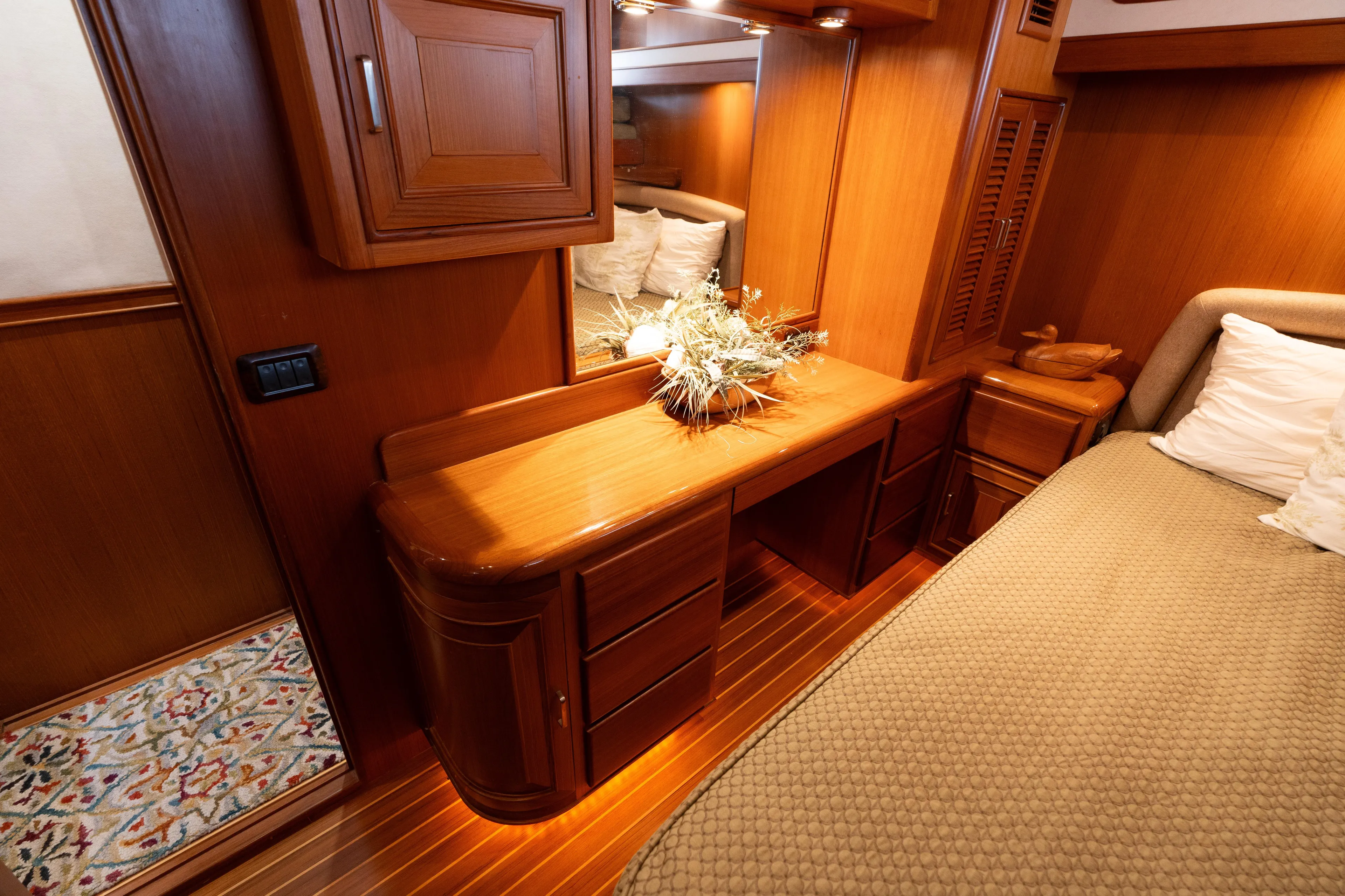 Fiddlesticks Yacht Photos Pics Luxurious wooden interior of a 2007 Fleming 55 yacht cabin with elegant decor.