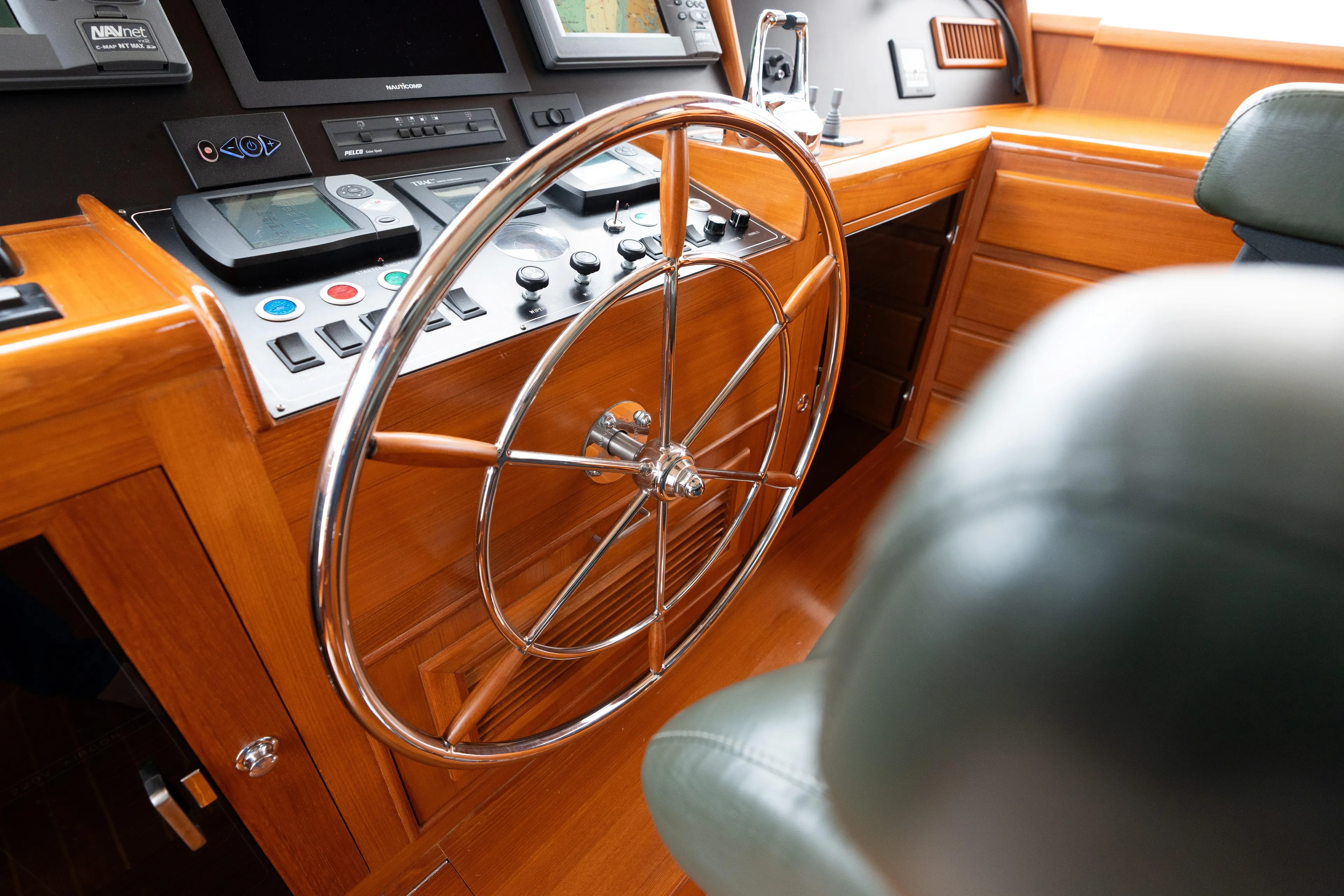 Fiddlesticks Yacht Photos Pics Steering wheel and control panel of 2007 Fleming 55 yacht cockpit.