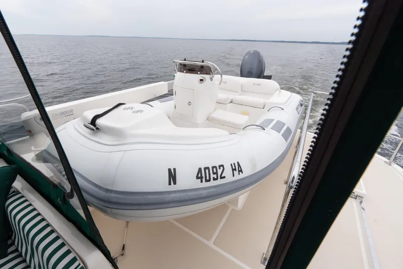 Fiddlesticks Yacht Photos Pics Inflatable boat on 2007 Fleming 55 yacht deck, cruising on open water.