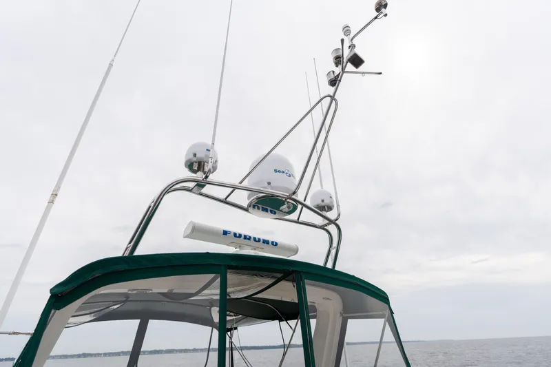 Fiddlesticks Yacht Photos Pics Radar and antenna equipment on a 2007 Fleming 55 yacht under cloudy skies.