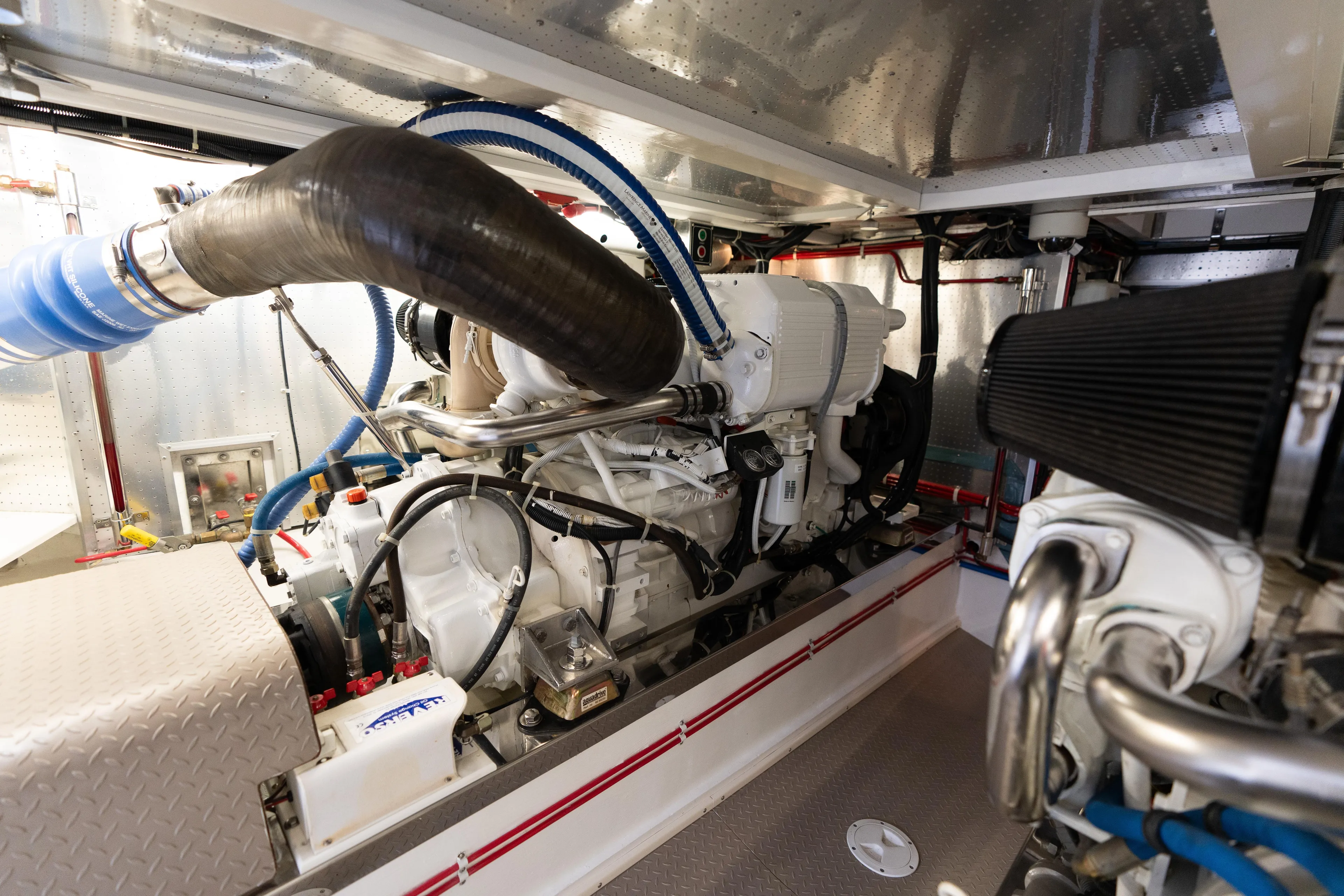 Fiddlesticks Yacht Photos Pics Engine room of a 2007 Fleming 55 yacht, showcasing detailed mechanical components.