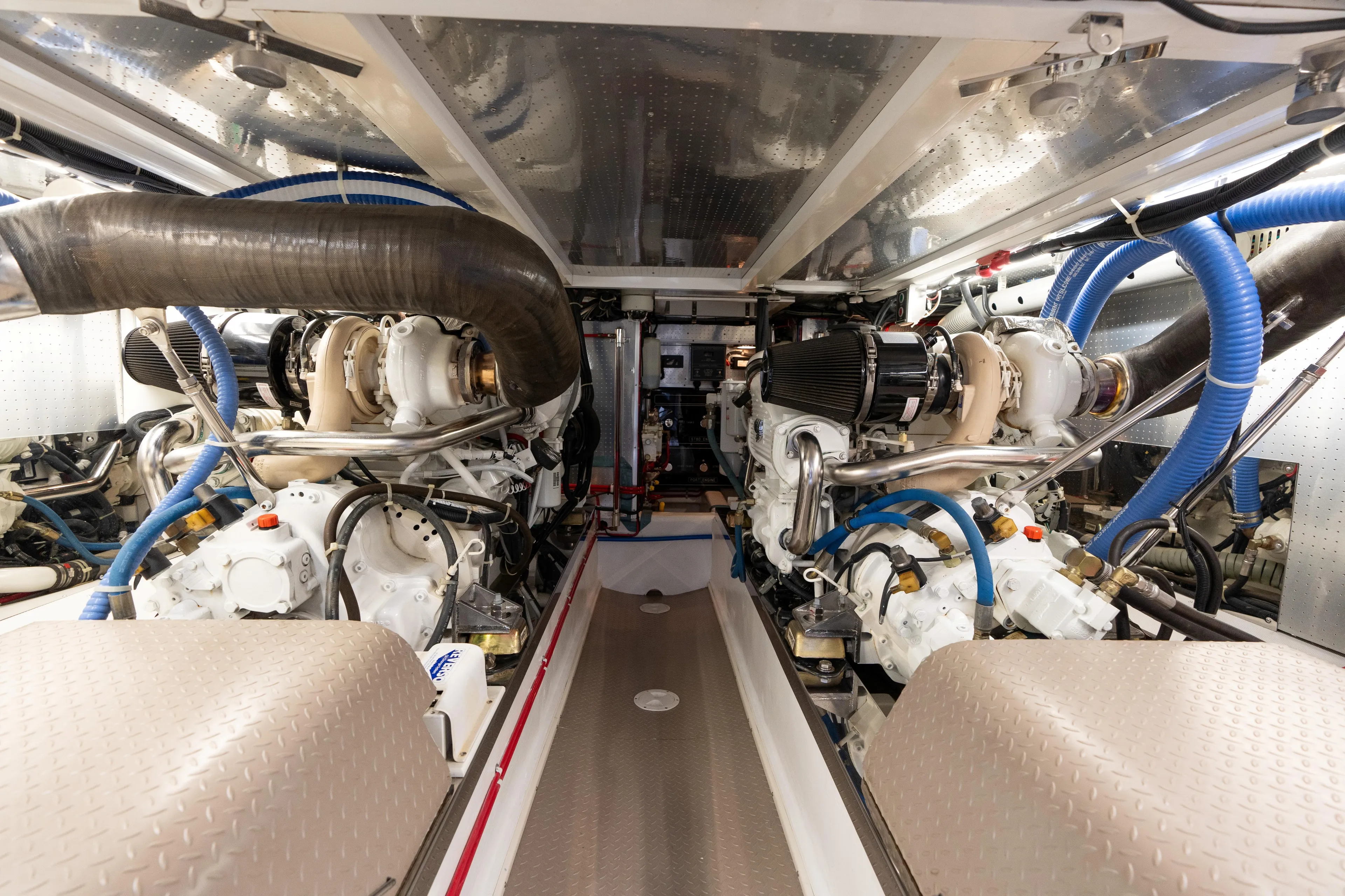 Fiddlesticks Yacht Photos Pics Engine room of a 2007 Fleming 55 yacht, showcasing dual engines and mechanical systems.