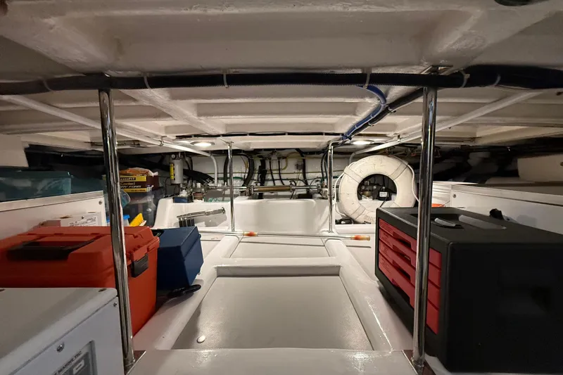 Fiddlesticks Yacht Photos Pics Engine room of a 2007 Fleming 55 yacht with organized tools and equipment.