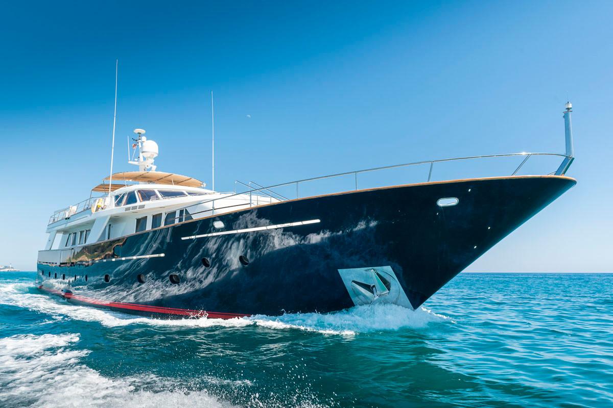 Luxurious 1988 Codecasa displacement yacht cruising on clear blue waters.