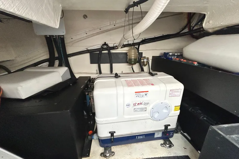 Party's Over Yacht Photos Pics Engine room of 2024 Regal 42 FXO boat with generator and equipment.