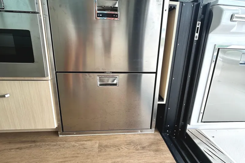 Party's Over Yacht Photos Pics Stainless steel appliances in 2024 Regal 42 FXO yacht interior kitchen.