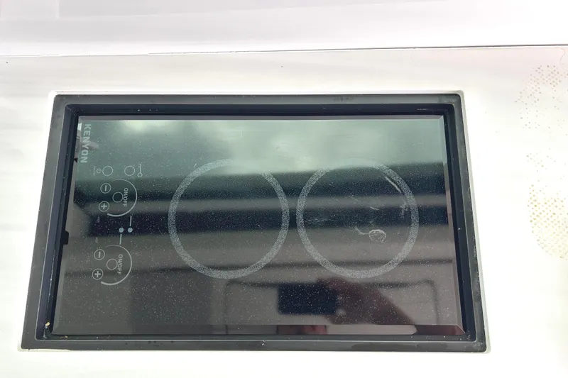 Party's Over Yacht Photos Pics Kenyon electric cooktop on 2024 Regal 42 FXO yacht, featuring dual burners.