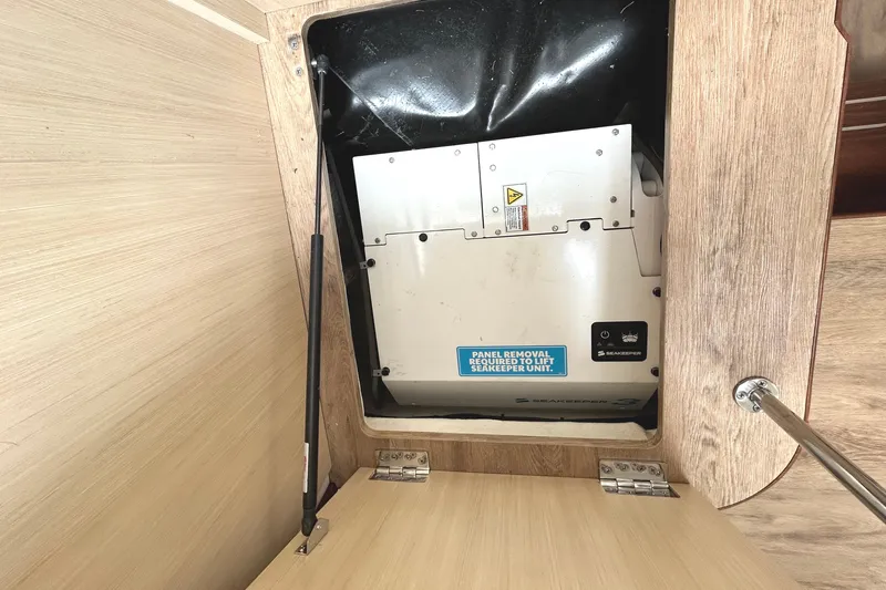 Party's Over Yacht Photos Pics Seakeeper unit in 2024 Regal 42 FXO yacht, panel removal required for access.