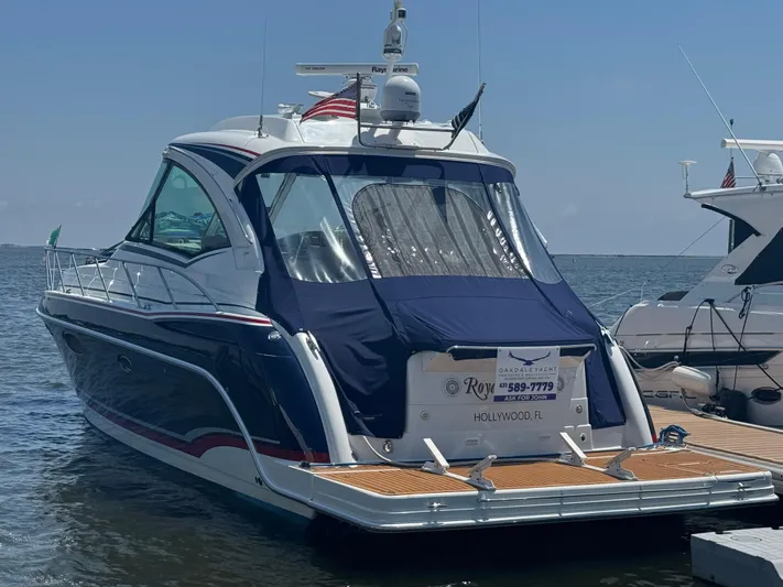  Yacht Photos Pics 2013 Formula 45 Yacht docked in Hollywood, FL, with blue cover and wooden deck.