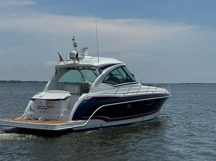  Yacht Photos Pics 2013 Formula 45 Yacht cruising on calm waters under a clear sky.