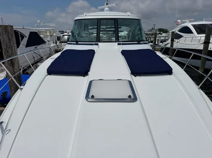  Yacht Photos Pics 2013 Formula 45 Yacht with blue cushions docked at marina.