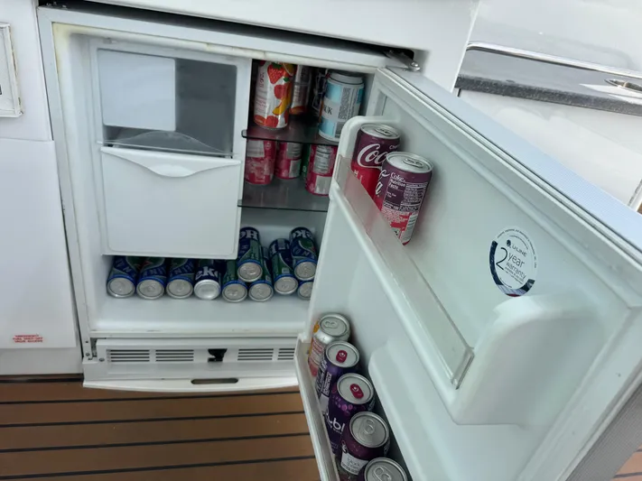  Yacht Photos Pics Open fridge on 2013 Formula 45 Yacht, stocked with assorted beverage cans.