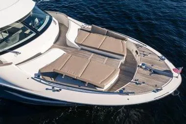  Yacht Photos Pics 2020 Monte Carlo Yachts MCY 66 with spacious sun deck and luxurious seating on open water.