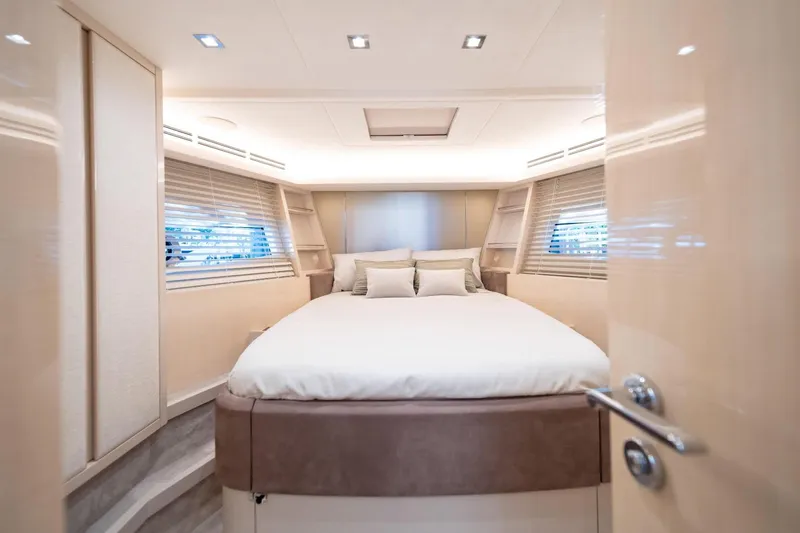  Yacht Photos Pics Luxurious bedroom interior of 2020 Monte Carlo Yachts MCY 66 with elegant design.