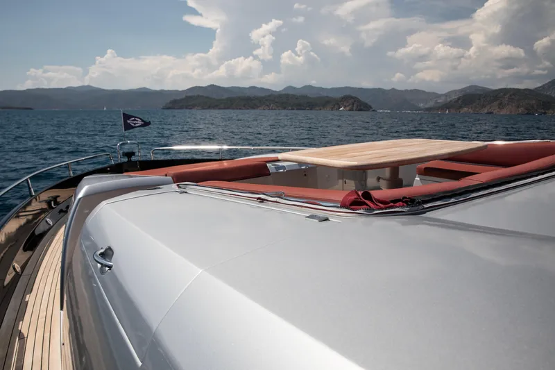  Yacht Photos Pics 2009 Sunseeker Predator 84 yacht deck with seating, table, and scenic ocean view.