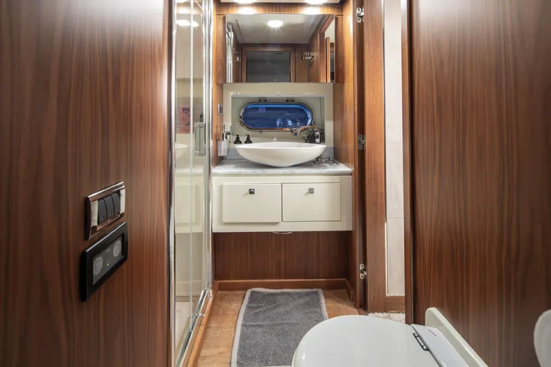  Yacht Photos Pics Luxurious bathroom interior of 2009 Sunseeker Predator 84 yacht with modern fixtures.