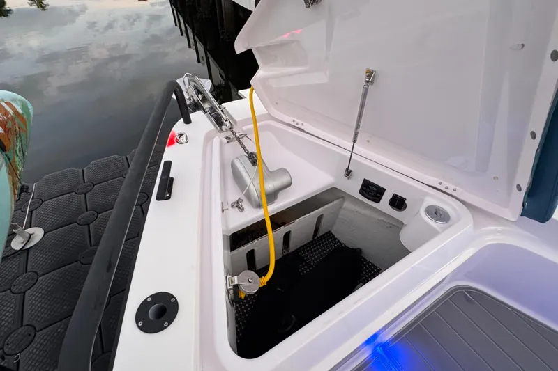  Yacht Photos Pics Open storage compartment on 2021 Axopar 37 boat, dockside view.