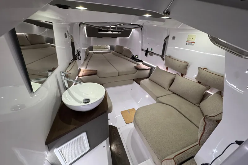  Yacht Photos Pics Luxurious interior of 2021 Axopar 37 Sun Top with modern seating and sleek design.