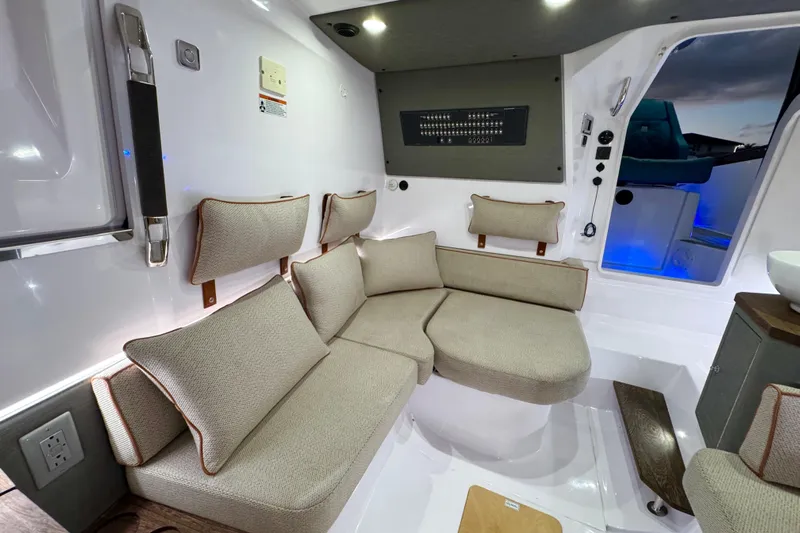  Yacht Photos Pics Interior of 2021 Axopar 37 Sun Top with beige seating and modern design.