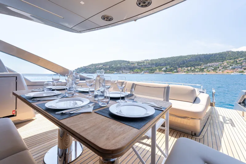 Ciao Yacht Photos Pics Luxurious dining setup on 2024 Pershing 7X yacht with scenic ocean view.