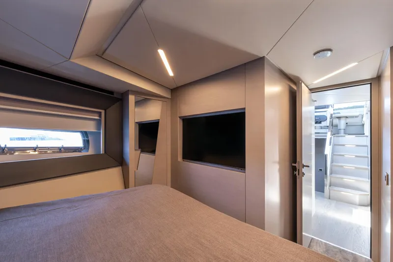 Ciao Yacht Photos Pics Luxurious interior of 2024 Pershing 7X yacht cabin with modern design and natural lighting.