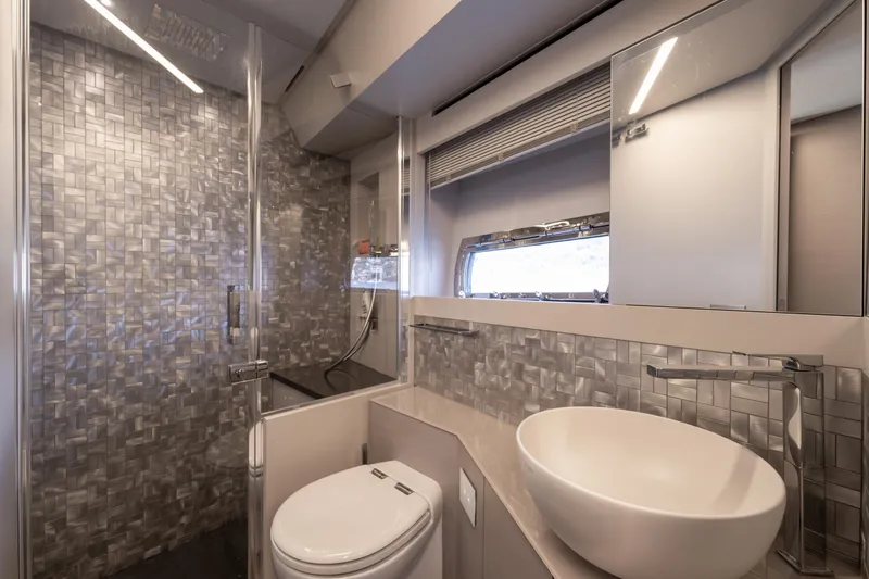 Ciao Yacht Photos Pics Luxurious bathroom in 2024 Pershing 7X yacht with modern fixtures and elegant design.