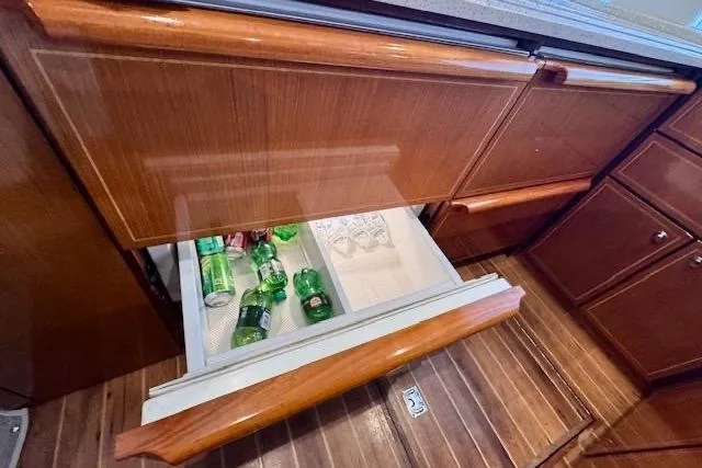 Pipe Dream Yacht Photos Pics Open drawer refrigerator on 2005 Ocean Yachts 50 Super Sport, stocked with beverages.