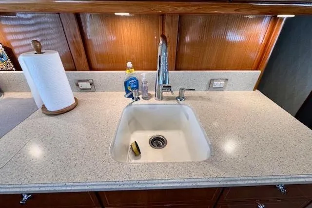 Pipe Dream Yacht Photos Pics Luxury yacht kitchen sink with modern faucet, 2005 Ocean Yachts 50 Super Sport model.