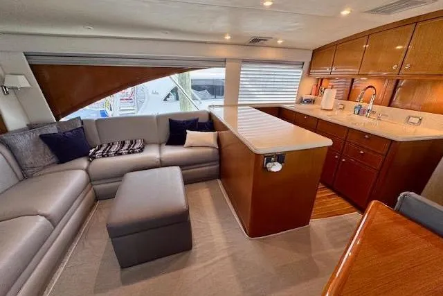 Pipe Dream Yacht Photos Pics Luxurious interior of 2005 Ocean Yachts 50 Super Sport with modern kitchen and cozy seating area.