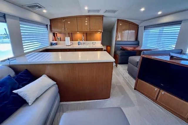 Pipe Dream Yacht Photos Pics Luxurious interior of 2005 Ocean Yachts 50 Super Sport with modern kitchen and seating area.
