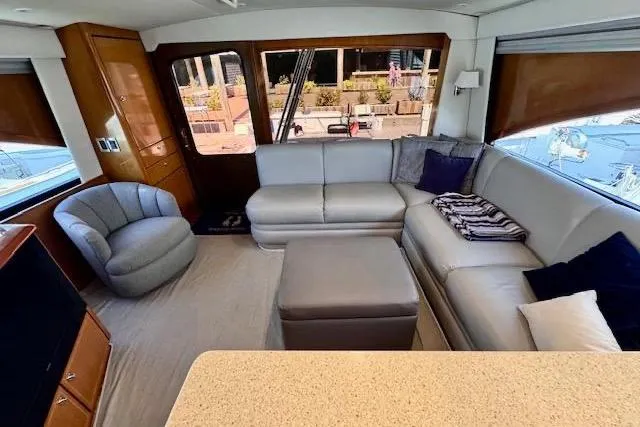 Pipe Dream Yacht Photos Pics Luxurious interior of 2005 Ocean Yachts 50 Super Sport with plush seating and modern decor.