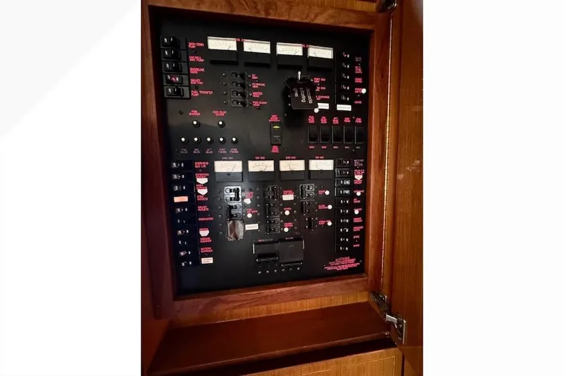 Pipe Dream Yacht Photos Pics Electrical panel of a 2005 Ocean Yachts 50 Super Sport boat, featuring various switches and controls.