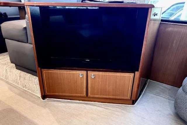 Pipe Dream Yacht Photos Pics Entertainment center with TV and cabinets on 2005 Ocean Yachts 50 Super Sport.