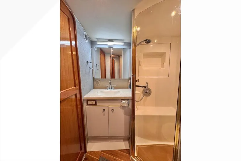 Pipe Dream Yacht Photos Pics Luxurious bathroom in 2005 Ocean Yachts 50 Super Sport with shower and vanity.