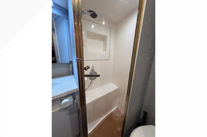Pipe Dream Yacht Photos Pics Shower area in 2005 Ocean Yachts 50 Super Sport, featuring modern fixtures and compact design.