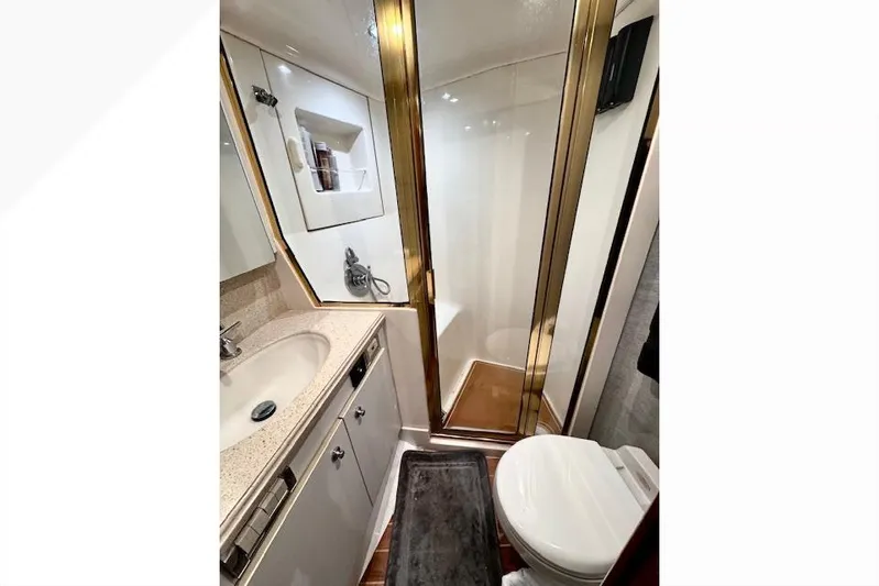 Pipe Dream Yacht Photos Pics Bathroom interior of 2005 Ocean Yachts 50 Super Sport with shower and vanity.