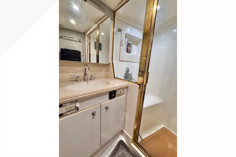Pipe Dream Yacht Photos Pics Luxurious bathroom in 2005 Ocean Yachts 50 Super Sport with shower and vanity.