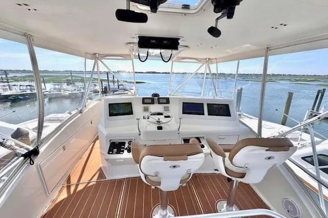 Pipe Dream Yacht Photos Pics 2005 Ocean Yachts 50 Super Sport helm with dual seats and navigation equipment.