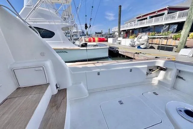 Pipe Dream Yacht Photos Pics 2005 Ocean Yachts 50 Super Sport docked, showcasing spacious deck and marina backdrop.