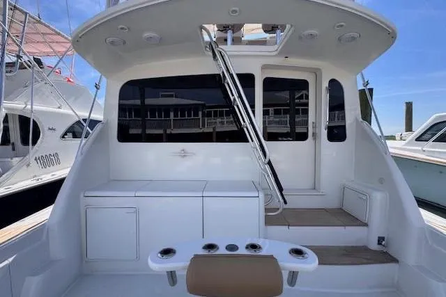 Pipe Dream Yacht Photos Pics 2005 Ocean Yachts 50 Super Sport boat deck with seating and storage.