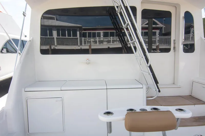 Pipe Dream Yacht Photos Pics 2005 Ocean Yachts 50 Super Sport yacht deck with ladder and seating area.