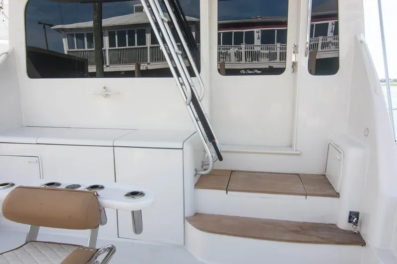 Pipe Dream Yacht Photos Pics 2005 Ocean Yachts 50 Super Sport yacht interior with seating and steps.